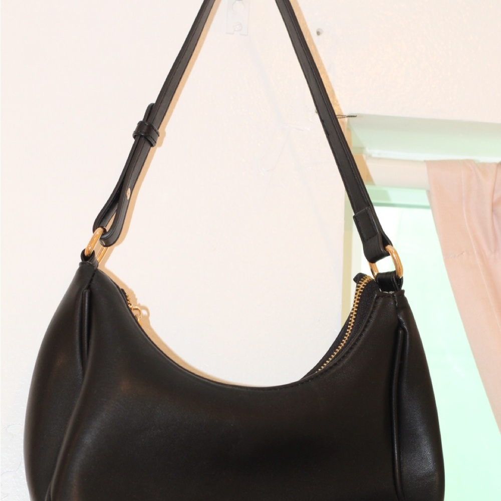 Black and Gold Leather Shoulder Bag with Sleek Design